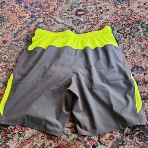 Nike Mesh Lined Swim Trunks with Neon Yellow Details.